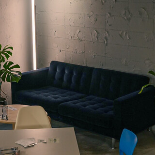 A calm dark navy 3-seater sofa seat. The most comfortable seat in the store.