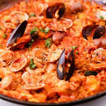 Mixed paella with meat, seafood and vegetables
