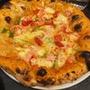 Pizzeria Braceria CESARI - ずわい蟹とチッポラヴェルデの蟹味噌入りトマトフォンドユータソースピッツア