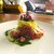 montalcino - 料理写真:大間のマグロの突先（とっさき）の上には、ラビゴットソースのエシャロットと紅心大根、西洋タンポポが美しく盛られ、芽紫蘇が飾られています。 それらの周囲をアンチョビがメインのイタリアンパセリのソースが添えられています。