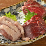 Three pieces of horse sashimi