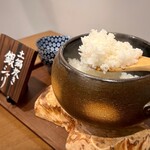 Silver rice cooked in an earthenware pot