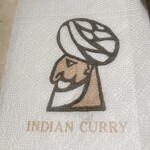 INDIAN CURRY - ナプキンにも居ました
      壁のをみた時はデカい口と思ったらヒゲのようだ