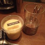 ゴーストスープ - やまもと菓子店さんのプリンと焼酎熱燗。