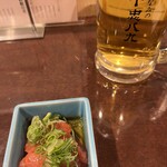 みなみの十忠八九 - お通しにごま油のかかった明太子でてきます。味濃いめ