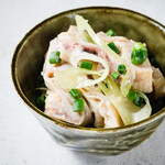 Sashimi covered with green onions