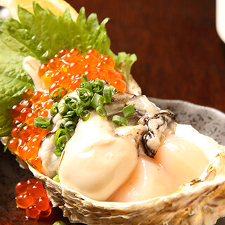 A gorgeous collaboration of raw scallops, raw Oyster, and salmon roe, ``Sea Jewel Box''