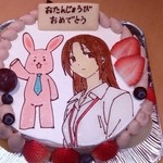 カイザーケルン - デコレーションケーキ「サー○ント×サービス」（左から百井課長、千早さん）