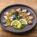 Live mackerel with sesame seeds