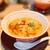 拉麺ひらり - 料理写真:麺は太くて平たい、モチモチの食感がたまらない。
          トマトの風味は控えめで、酸味が効いたスープが麺と見事に調和している。