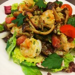 Bistro salad with shrimp, bacon, and mushrooms