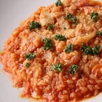Tomato risotto with bacon and porcini mushrooms