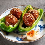 Raw peppers and meatballs with sauce