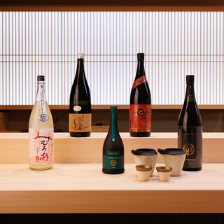 “Sake” and “wine” decorate sushi