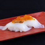 Two pieces of sword tip squid topped with sea urchin