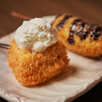 Fried Baumkuchen with whipped cream