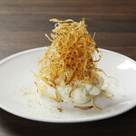 Special potato salad topped with crispy new burdock root