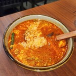 焼肉ホルモン 亀萬 - カルビスープに小ライス投入