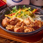 Free-range chicken and Kujo green onion on yuzu pepper iron plate