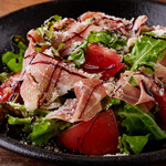 Arugula salad with Prosciutto and tomato