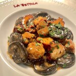 Orecchiette (handmade pasta) made with octopus and spicy sausage. Olio with squid ink.