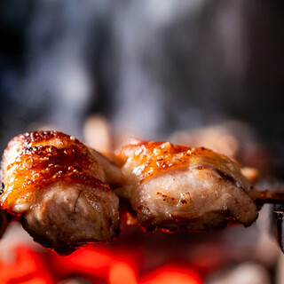 Grilled chicken over binchotan charcoal is moist and juicy and goes well with alcohol.