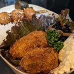 Maruoka - 大きな牡蠣がふたつ、タルタルソースも自家製、ひじきの煮たのと鶏つくね串は、わたしが担当する特製まるおか御膳にも付いてます。