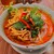 タイの食卓 クルン・サイアム - 料理写真:カオソーイ。タイ北部チェンマイのカレーヌードル。真っ赤だが見た目と違ってそれほど辛くない。