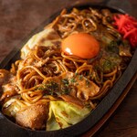 Yakisoba (stir-fried noodles) noodles with special sauce topped with tsukadama