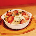 Truffle-flavored bacon and potato gratin with soft-boiled eggs