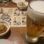 横濱串工房 - プレミアムビールと　お通しの豚の角煮　ちょこっとの角煮だけど煮込んであって美味しい（2024/04/14撮影）