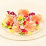 A vibrant antipasto Prosciutto and cream cheese sprinkled with flowers