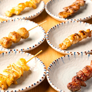 Authentic Yakitori (grilled chicken skewers) carefully grilled one by one