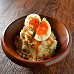 Meat miso potato salad topped with soft-boiled egg