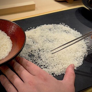 Rice is visually selected one grain at a time