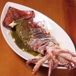 Whole grilled squid with chimichurri sauce