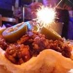メキシコ酒場 サンズ・ダイナー - 貝殻のパイのお皿にライスとパラペーニョが乗っています。