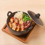 Softly boiled octopus and fresh ginger in a clay pot