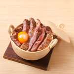 Beef and burdock rice cooked in a clay pot