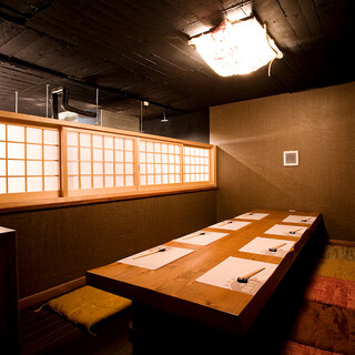 The sunken kotatsu seats are a cozy space with handmade Japanese paper lighting.