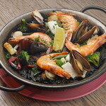 Seafood paella with squid ink