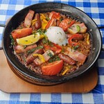 Curry paella with chorizo and thick-sliced bacon