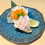 Raw oysters topped with plenty of Oyster roe and crab