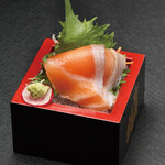Small serving of salmon sashimi