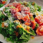 Green salad with fresh tomatoes and Parmesan