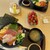 魚太郎 - 料理写真:奥がサーモンずくし丼、手前が海鮮丼。いちごとシュークリームは隣の市場で購入