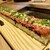 焼肉名匠 山牛 - 料理写真:お〜寿司は♬続く〜よ♬何処迄も〜♬
          50cmの牛レア寿司がコレだ！