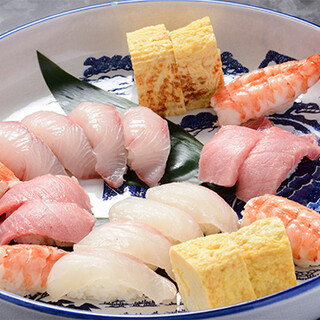 A variety of dishes showcasing the chef's skill, including Sushi, sashimi, and other fish dishes.