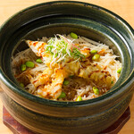 Conger eel Tempura and fresh ginger cooked in a clay pot