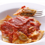 Homemade ravioli with tomato sauce